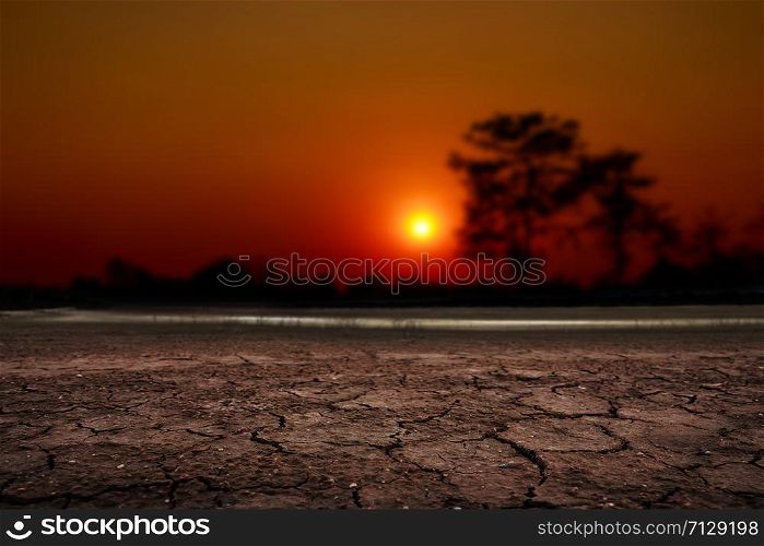 sunset over cracked desert