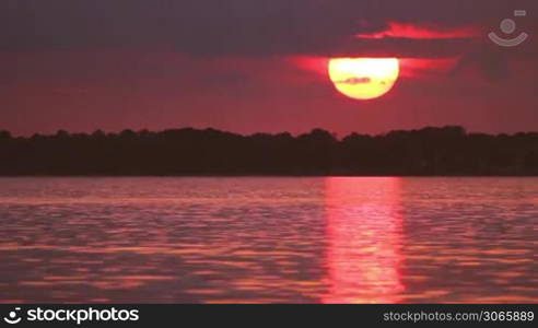 sunset over Eckernforde near the german city Kiel at the Baltic Sea, time-lapse with sunset, Sonnenuntergang vor dem Urlaubsort Eckernforde, Ostsee, nahe Kiel