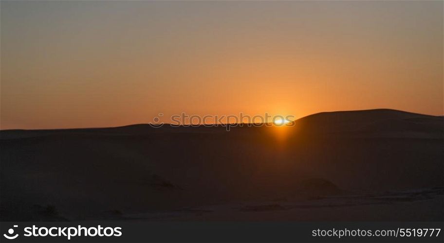 Sunset over Erg Chegaga Dunes in Sahara Desert, Morocco