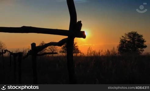 Sunset over field, HD time lapse clip.