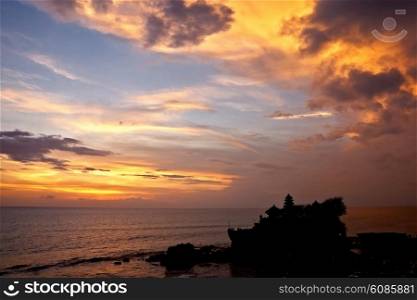 sunset over hindu temple Tanah Lot, Bali, Indonesia