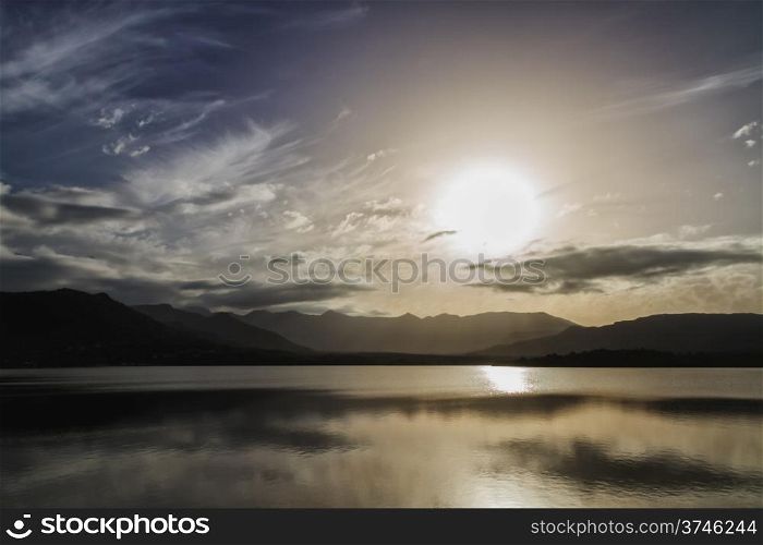 Sunset over Lac de Codole at Reginu in the Balagne region of Corsica with mountains in background