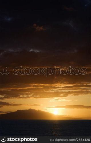 Sunset over Pacific Ocean and Kihea island in Maui, Hawaii, USA.