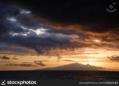 Sunset over Pacific Ocean and Kihea island in Maui, Hawaii, USA.
