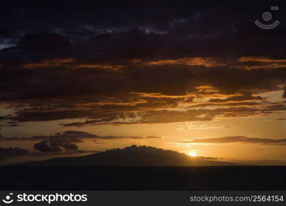 Sunset over Pacific Ocean and Kihea island in Maui, Hawaii, USA.