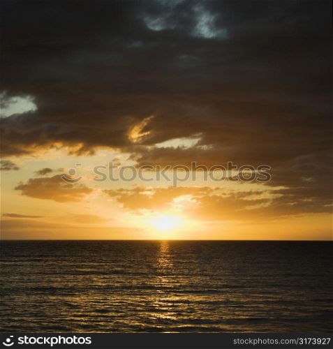 Sunset over Pacific Ocean in Maui, Hawaii, USA.