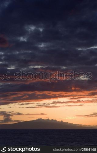 Sunset over Pacific Ocean with clouds in Maui, Hawaii, USA.