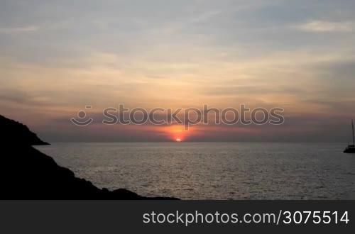 Sunset over sea and mountains