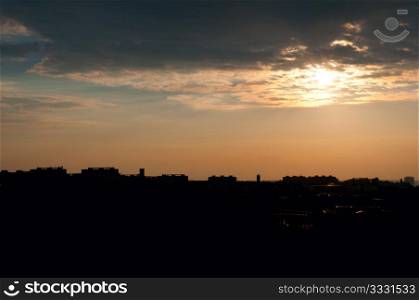 Sunset over Silhouette of City LIne
