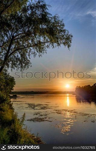 Sunset over the Dnieper river in Kiev, Ukraine, during a warm summer evening.