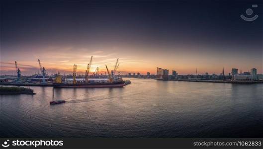Sunset over the harbour of Hamburg