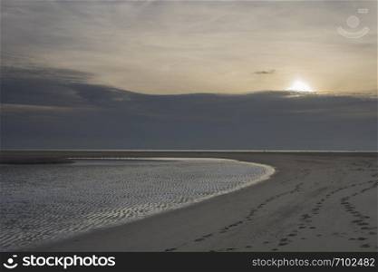 Sunset over the Maasvlakte beach near the port of Rotterdam. Sunset Maasvlakte beach