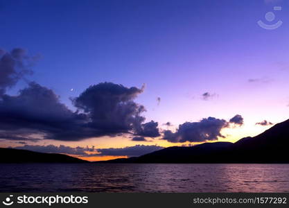 Sunset over the mountain lake