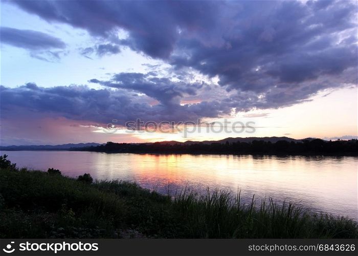 sunset over the river with beautiful cloud sky background. sunset over the river