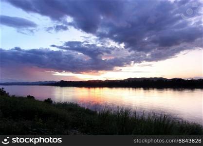 sunset over the river with beautiful cloud sky background. sunset over the river