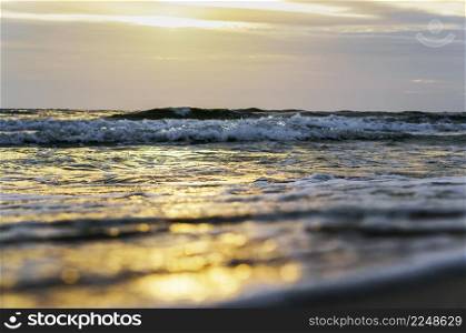 Sunset over the sea. Reflection of sunlight in the sea waves. The sky in the sunset rays. Baltic Sea.. Sunset over the sea. Reflection of sunlight in the sea waves. Baltic Sea.