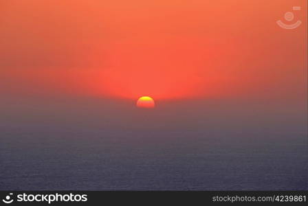 Sunset over the west coast of rhodes near monolithos