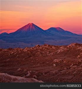 sunset over volcanoes Licancabur and Juriques, Atacama desert, Chile