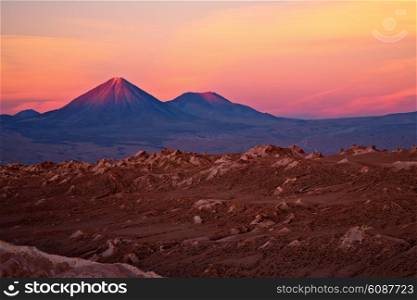 sunset over volcanoes Licancabur and Juriques, Atacama desert, Chile