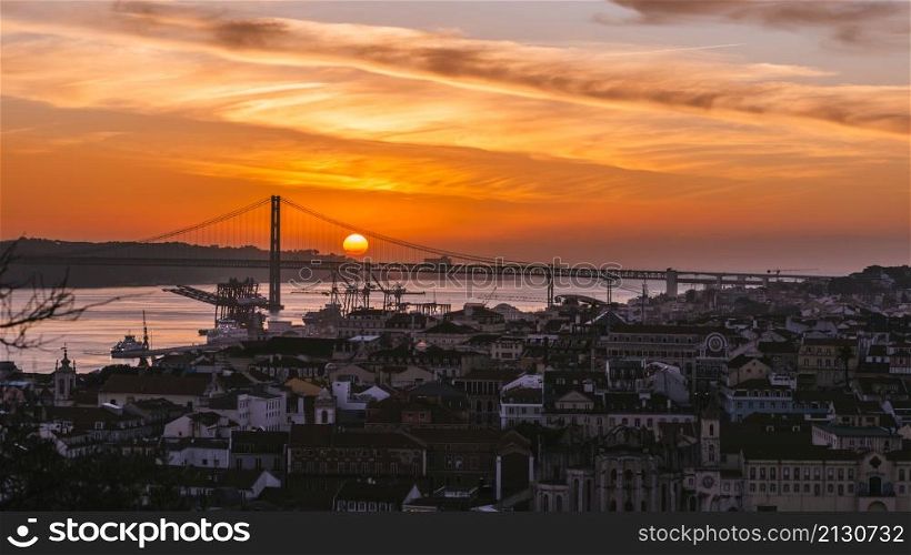 Sunset overlooking Lisbon&rsquo;s Baixa and 25 April Bridge on the Tagus River, Portugal