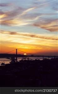 Sunset overlooking Lisbon&rsquo;s Baixa and 25 April Bridge on the Tagus River, Portugal