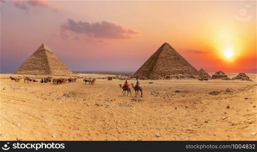 Sunset panorama of the Great Pyramids of Giza, Egypt.. Sunset panorama of the Great Pyramids of Giza, Egypt
