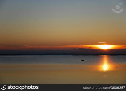 Sunset reflections by the coast at the swedish island Oland