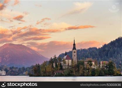 Sunset scene of Bled lake in Slovenia, famous and popular travel destination. Picturesque Slovenia, Bled lake and town in the evening