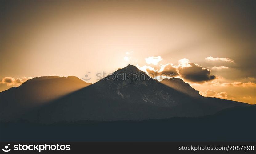 Sunset scenery on a mountain, cloudy sky