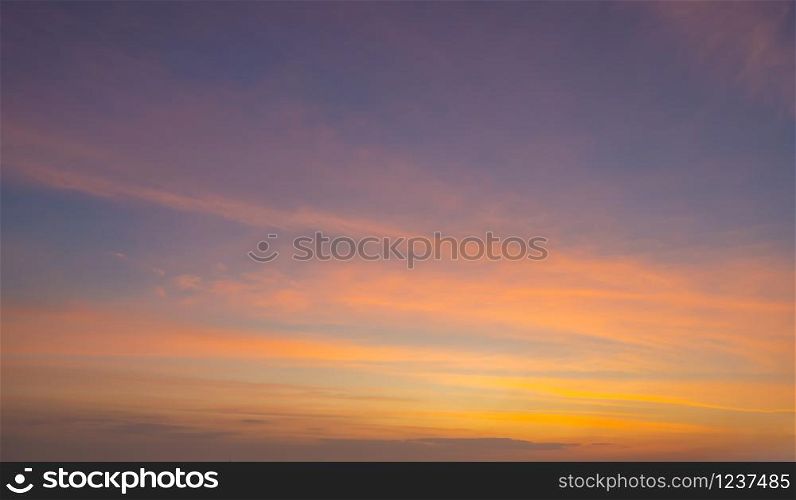 Sunset sky. Abstract nature background. Dramatic blue and orange, colorful clouds at twilight time.