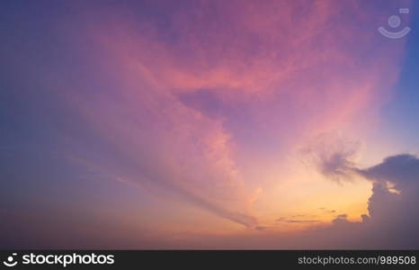 Sunset sky. Abstract nature background. Dramatic blue and orange, colorful clouds at twilight time.