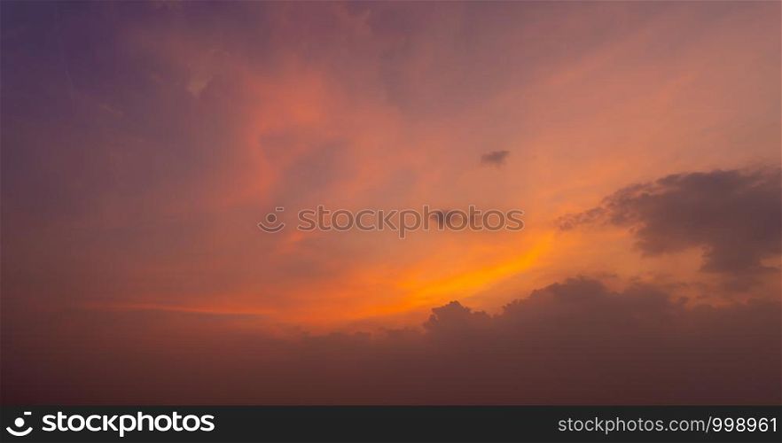Sunset sky. Abstract nature background. Dramatic blue and orange, colorful clouds at twilight time.