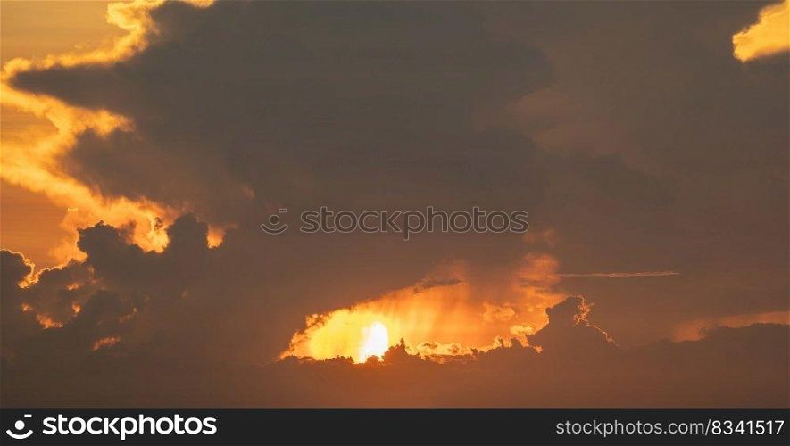 Sunset sky. Abstract nature background. Dramatic blue with oran≥colorful clouds in twilight time.