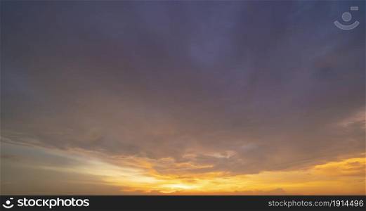 Sunset sky. Abstract nature background. Dramatic blue with orange colorful clouds in twilight time.