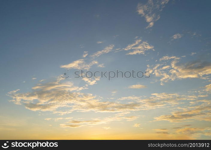 Sunset sky. Abstract nature background. Dramatic blue with orange colorful clouds in twilight time.