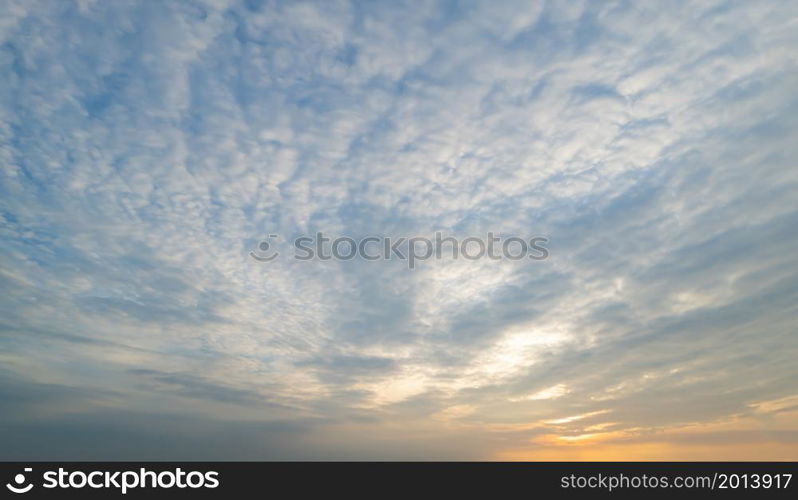 Sunset sky. Abstract nature background. Dramatic blue with orange colorful clouds in twilight time.