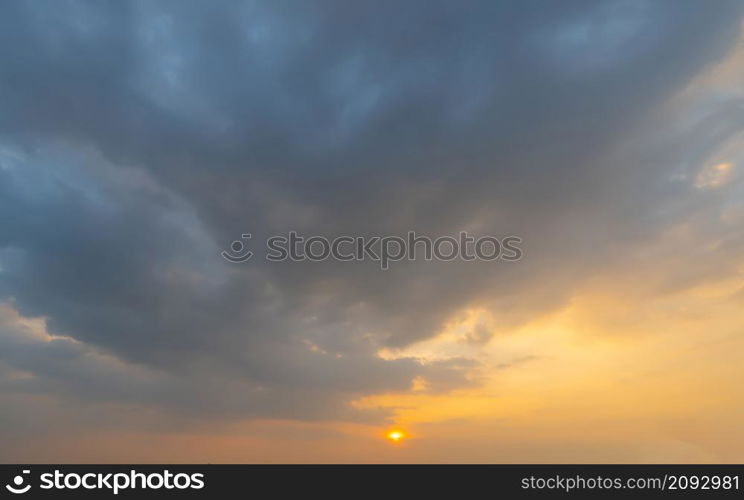 Sunset sky. Abstract nature background. Dramatic blue with orange colorful clouds in twilight time.