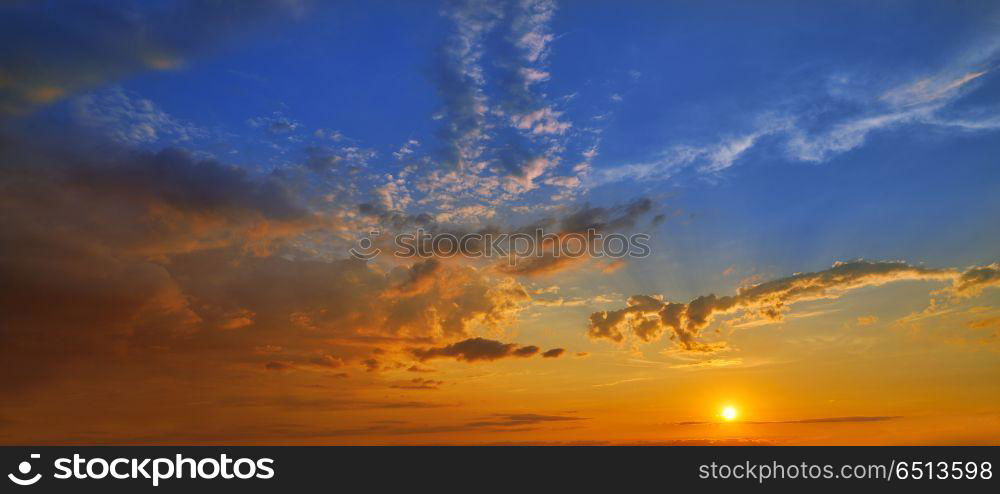 sunset sky in orange and blue. sunset sky in orange and blue blackground