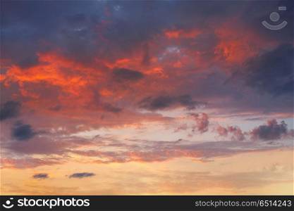 sunset sky in orange and blue. sunset sky in orange and blue blackground