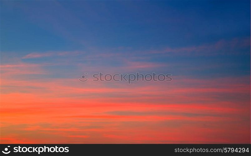 Sunset sky in red orange and blue texture background