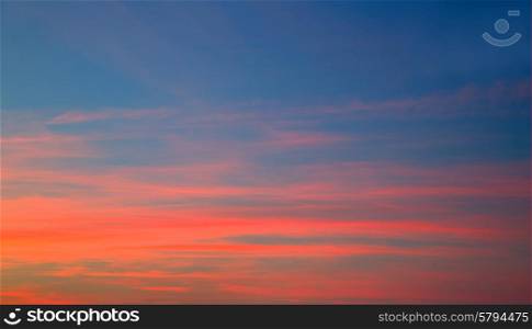 Sunset sky in red orange and blue texture background