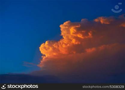 Sunset sky orange clouds on blue colorful Caribbean cloudscape