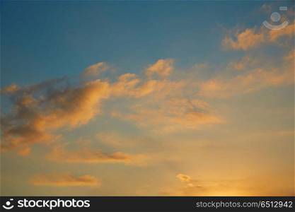 Sunset sky orange clouds on blue sky. Sunset sky orange clouds on blue sky at dusk