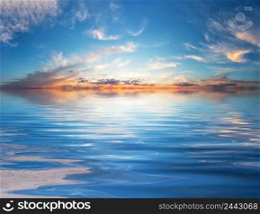 Sunset sky over the water surface. Sunset sky over water surface