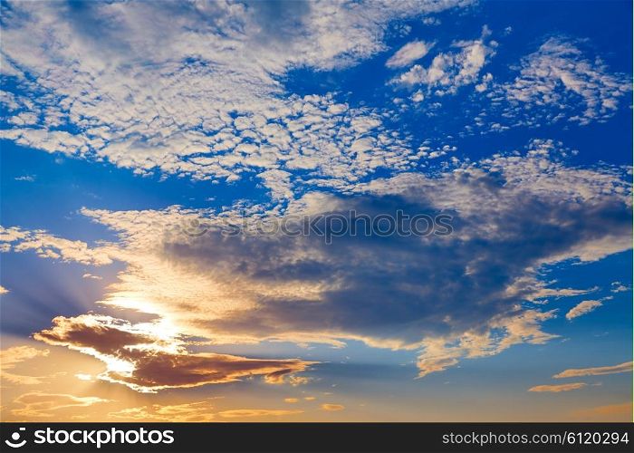 Sunset sky with golden and blue clouds in Mediterranean