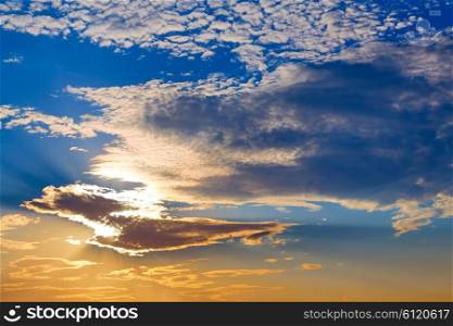 Sunset sky with golden and blue clouds in Mediterranean