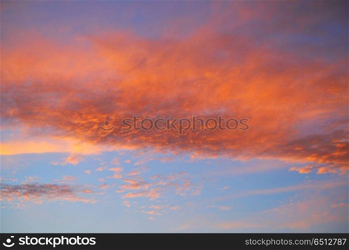 Sunset sky with orange clouds and blue. Sunset sky with orange clouds and blue background skies