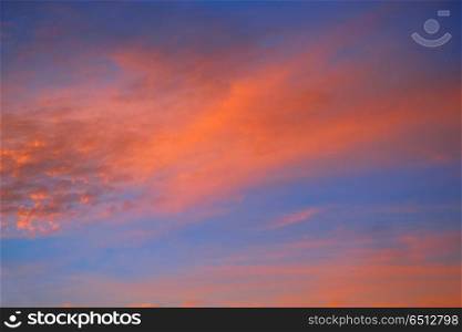 Sunset sky with orange clouds and blue. Sunset sky with orange clouds and blue background skies