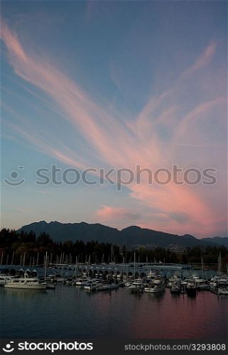 Sunset skyline and boats docked in Vancouver, British Columbia, Canada