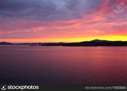 sunset view from a boat off the coast of norway
